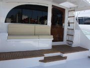 Dun-Rite had the exterior topsides faired and painted including cabin, cockpit, bridge, toerail and foredeck. We installed teak sole on the mezzanine and a new salon door...