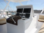 ...varnished teak seat fiddles and helm pod in the bridge...