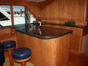 ...cherry veneer, stools, granite counter-tops...
