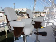...varnished teak seat fiddles and helm pod in the bridge...